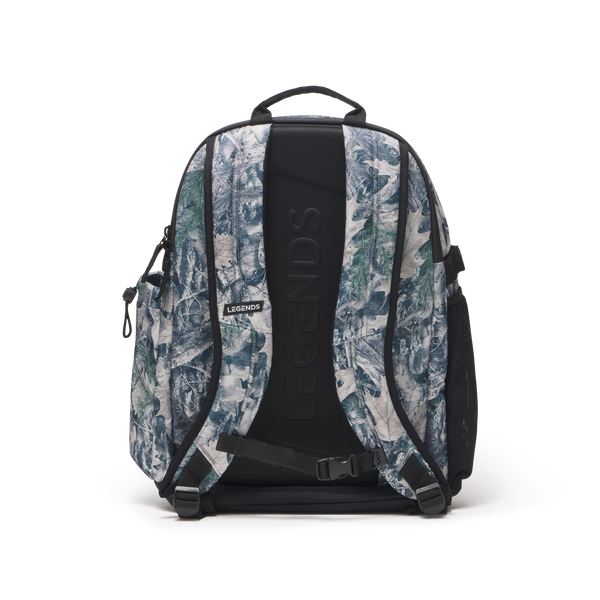 Brazer backpack with forest camo sage pattern, black straps, and padded back panel shown from rear view.