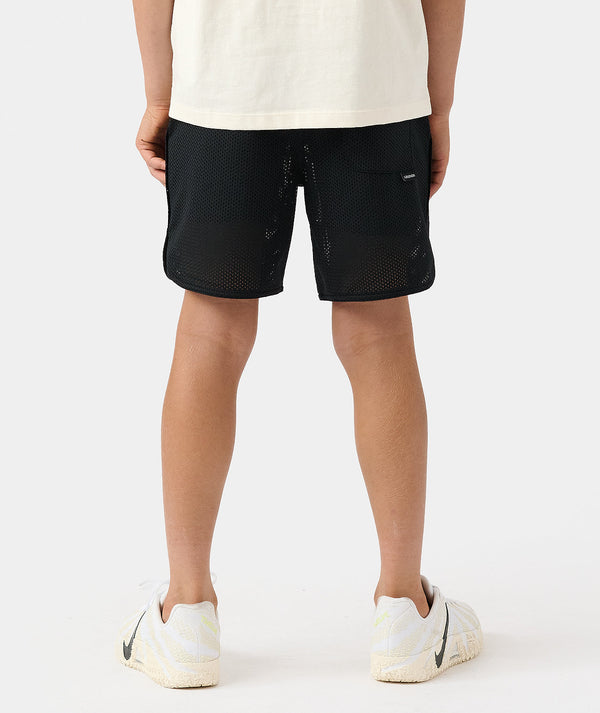 Black mesh shorts with perforated fabric and drawstring waist, worn with white sneakers.