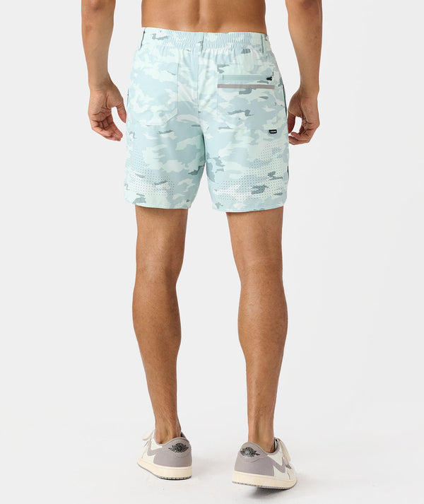 Cloud blue camouflage golf shorts with elastic waistband and textured side panels on male model.