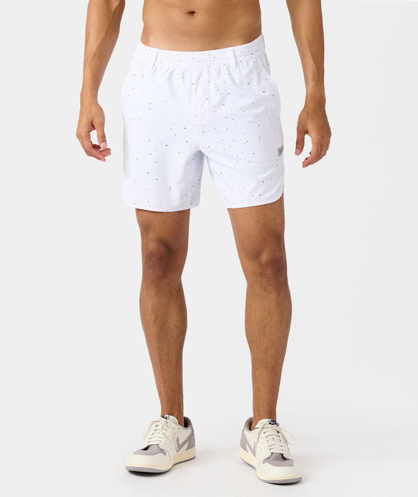 White golf shorts with black splatter pattern and elastic waistband.