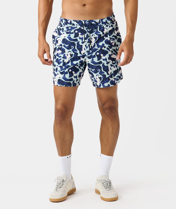 Men's shorts in navy, light blue, and white camouflage pattern with drawstring waist.