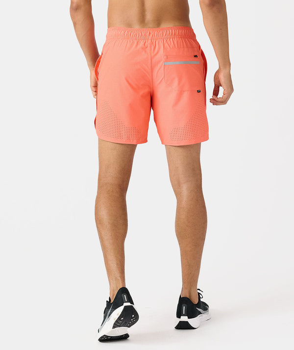 Coral pink men's athletic shorts with perforated mesh panels, back pocket with reflective strip, and elastic waistband.