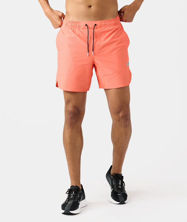 Men's coral pink swim shorts with drawstring waist and side pockets.