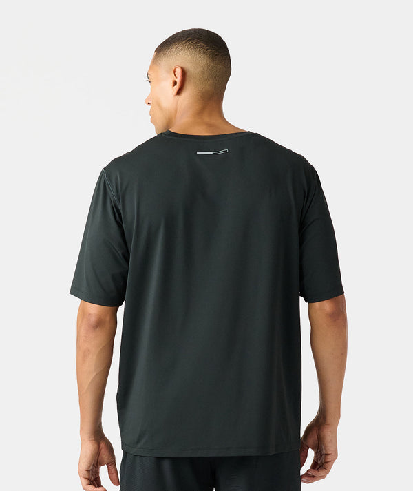 Black short-sleeve t-shirt with small back neck detail, shown on male model from behind.