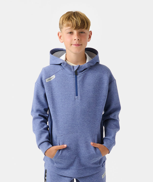 Child wearing heather blue quarter-zip hoodie with navy hood lining and front kangaroo pocket.