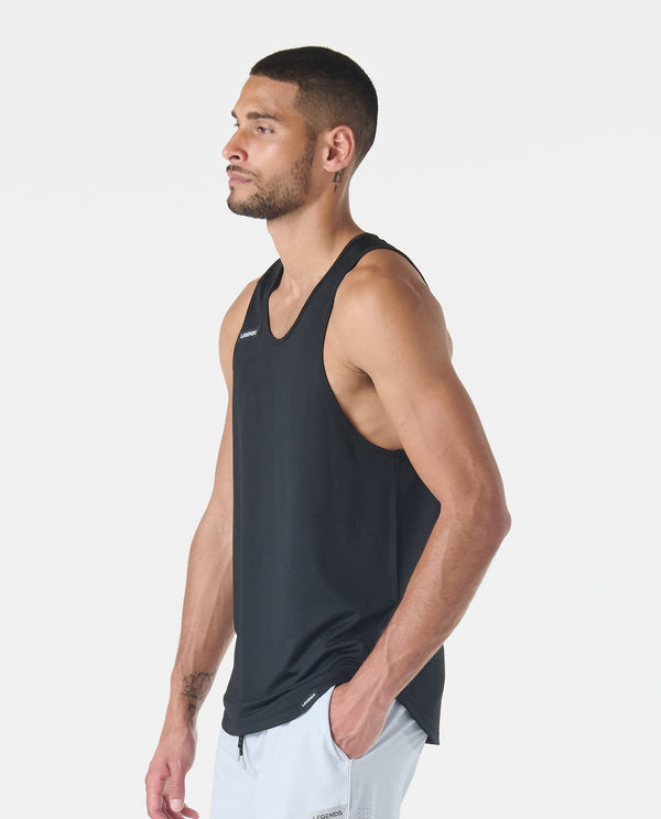 Black sleeveless tank top with V-neckline and brand logo on chest, shown on model in side profile.