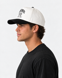 White and black baseball cap with "LEGENDS" graphic and crest emblem on front.