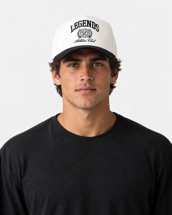 White and black baseball cap with "Legends Athletic Club" emblem on the front.