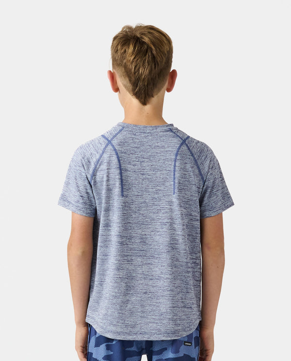 Child wearing ocean heather short-sleeve t-shirt with raglan sleeves and curved hem, shown from back.